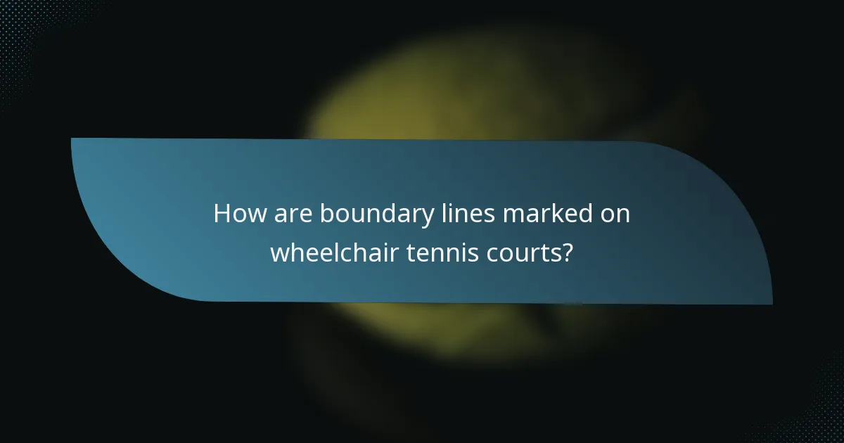 How are boundary lines marked on wheelchair tennis courts?