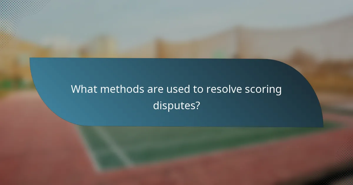 What methods are used to resolve scoring disputes?